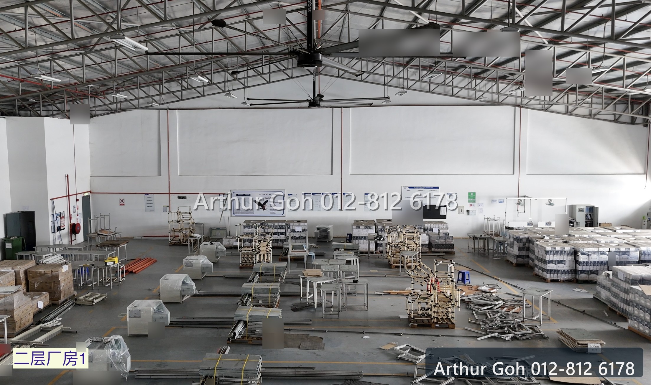 Wide second-floor warehouse interior with roof trusses