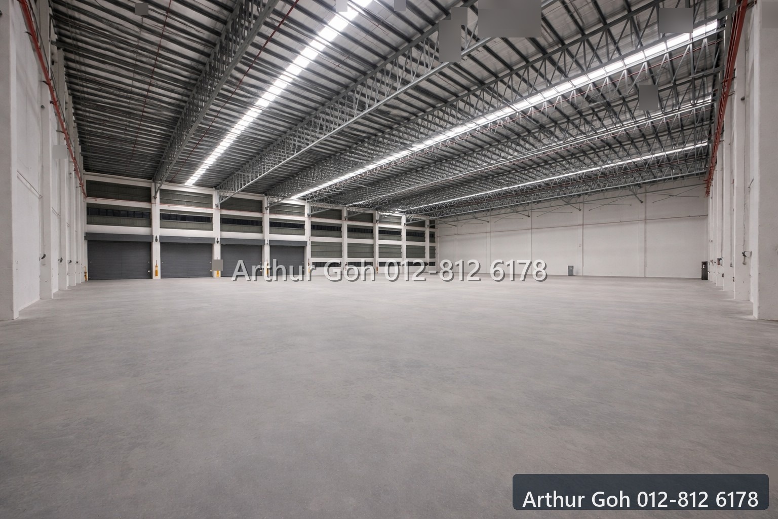 Wide industrial warehouse interior with high roof