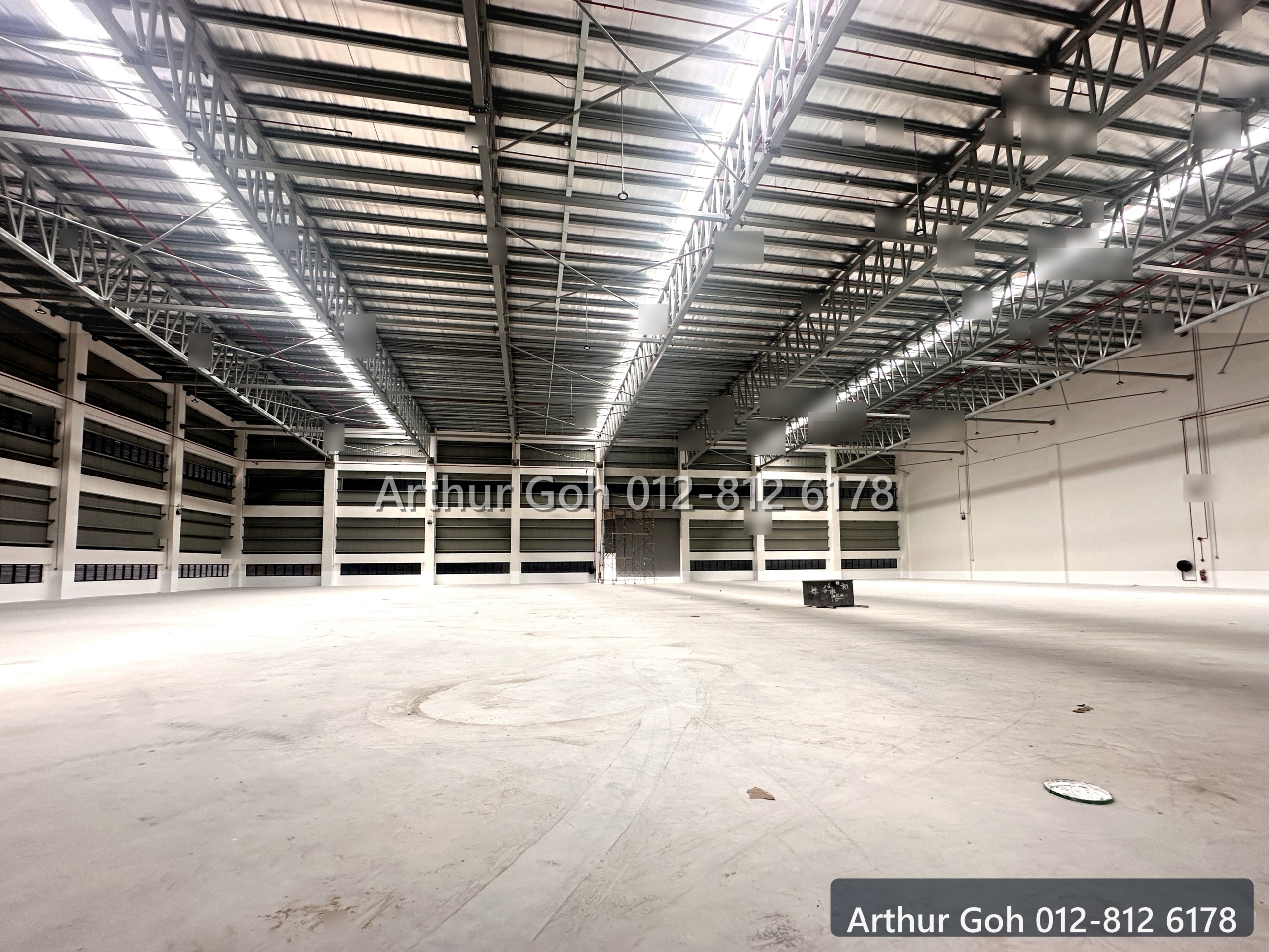 Bright warehouse interior showing structural span